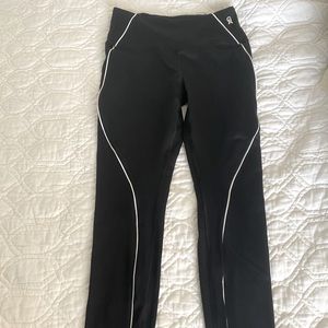 Good American size 2 black leggings with white piping.